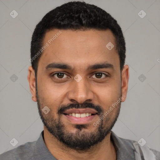 Joyful black young-adult male with short  black hair and brown eyes