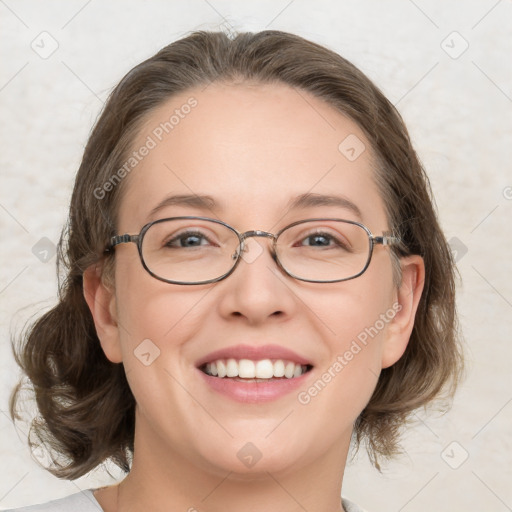 Joyful white adult female with medium  brown hair and grey eyes