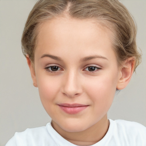 Joyful white child female with short  brown hair and brown eyes