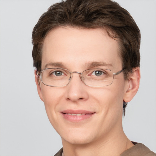 Joyful white adult female with short  brown hair and grey eyes