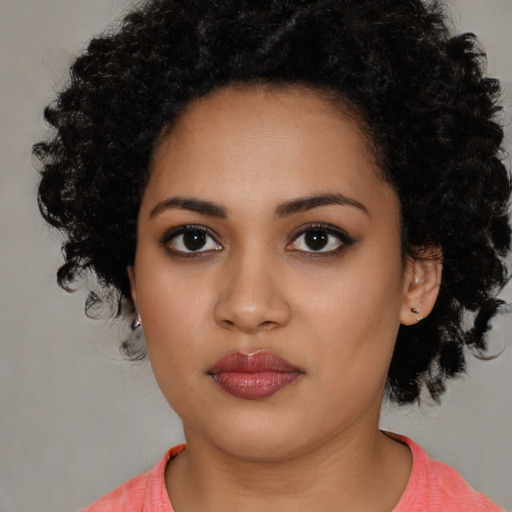 Neutral latino young-adult female with long  black hair and brown eyes