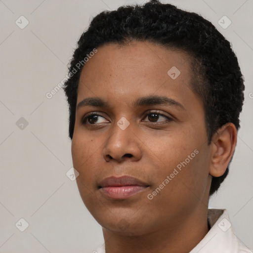 Joyful black young-adult female with short  black hair and brown eyes