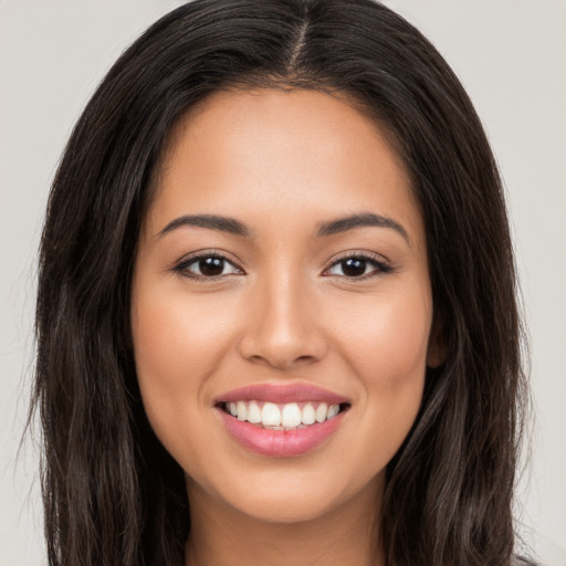 Joyful white young-adult female with long  brown hair and brown eyes