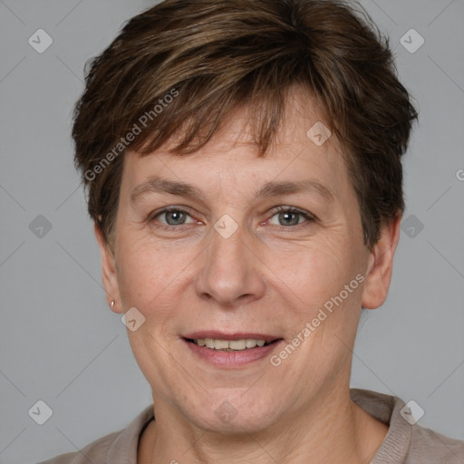 Joyful white adult female with short  brown hair and grey eyes