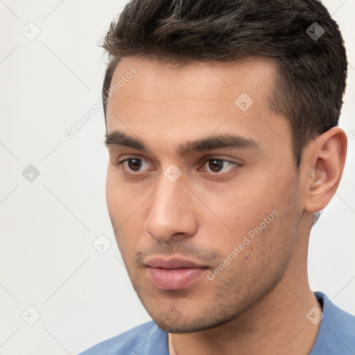 Neutral white young-adult male with short  brown hair and brown eyes