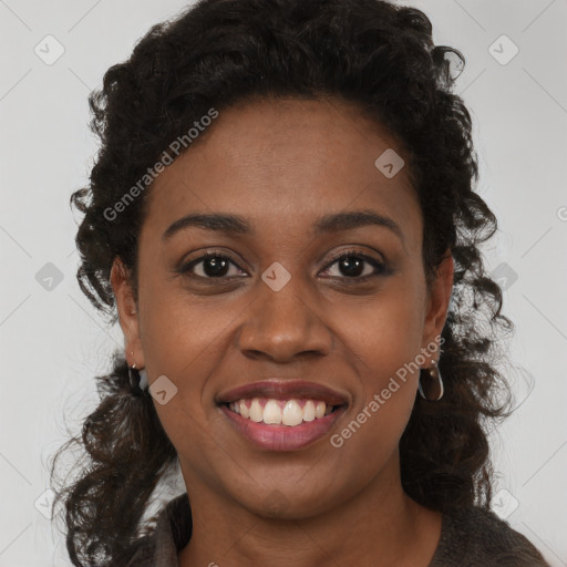 Joyful black young-adult female with medium  brown hair and brown eyes