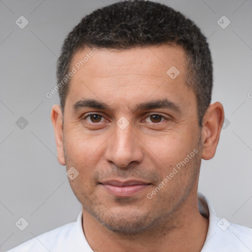 Joyful white adult male with short  brown hair and brown eyes