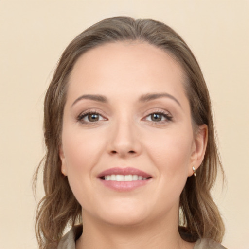 Joyful white young-adult female with long  brown hair and brown eyes