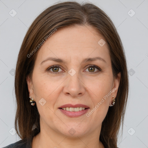 Joyful white adult female with medium  brown hair and brown eyes