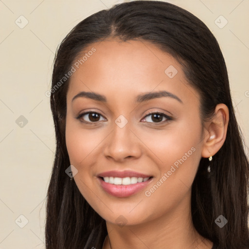 Joyful latino young-adult female with long  brown hair and brown eyes