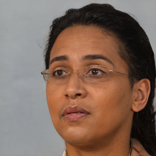 Neutral black adult female with short  brown hair and brown eyes
