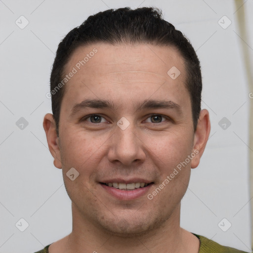 Joyful white young-adult male with short  brown hair and brown eyes