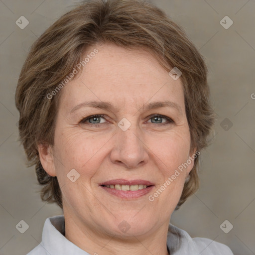 Joyful white adult female with medium  brown hair and grey eyes