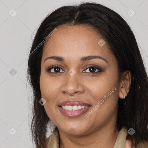 Joyful latino young-adult female with long  brown hair and brown eyes