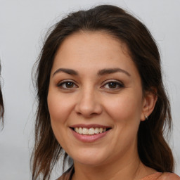 Joyful white young-adult female with medium  brown hair and brown eyes