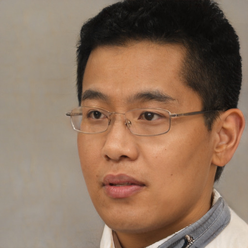 Neutral asian adult male with short  black hair and brown eyes