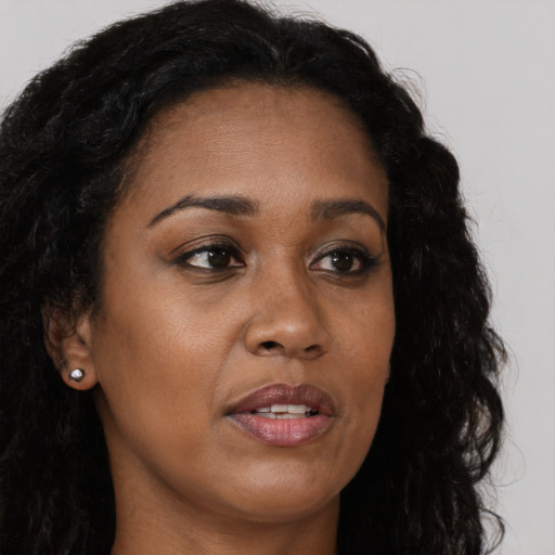 Neutral black adult female with long  brown hair and brown eyes
