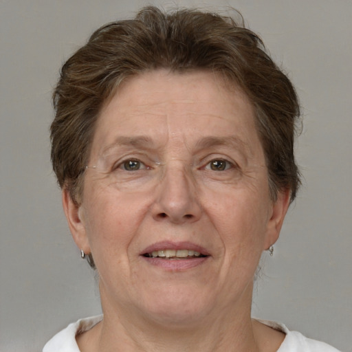 Joyful white middle-aged female with short  brown hair and brown eyes