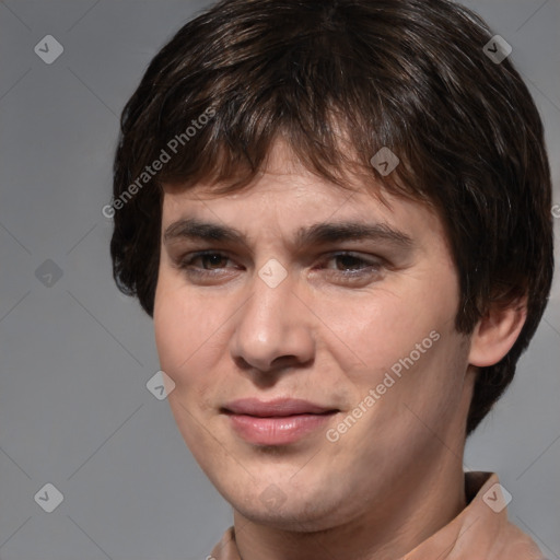 Joyful white young-adult male with medium  brown hair and brown eyes