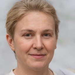 Joyful white adult female with short  brown hair and brown eyes