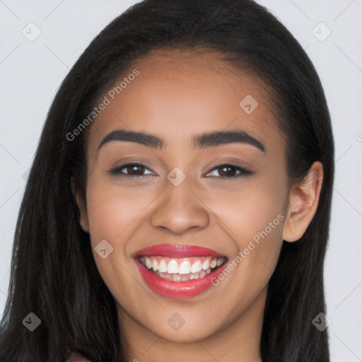 Joyful latino young-adult female with long  brown hair and brown eyes