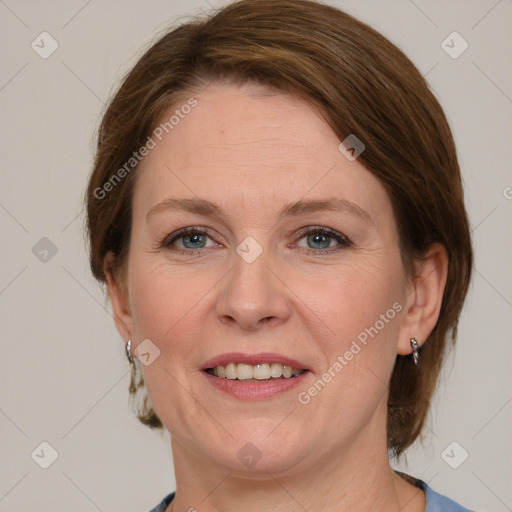 Joyful white adult female with medium  brown hair and grey eyes