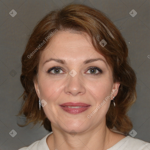 Joyful white adult female with medium  brown hair and brown eyes