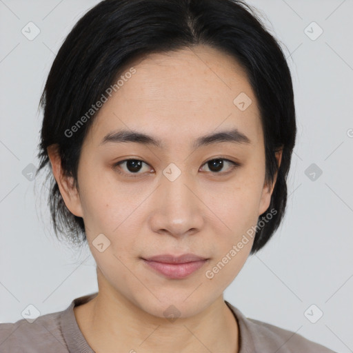 Joyful asian young-adult female with medium  black hair and brown eyes