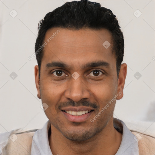 Joyful latino young-adult male with short  black hair and brown eyes
