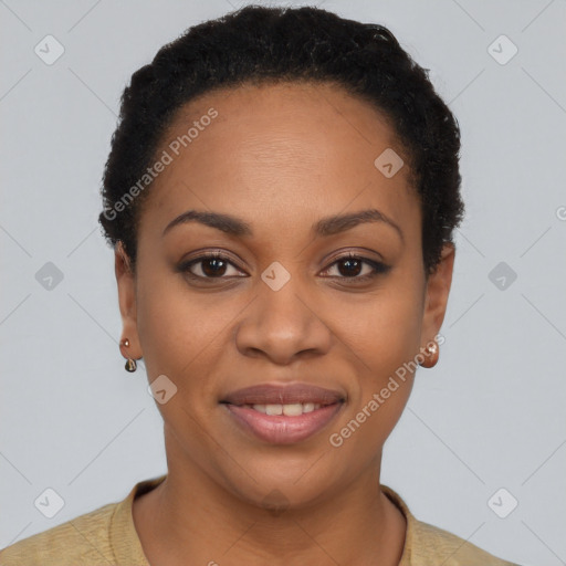 Joyful black young-adult female with short  black hair and brown eyes