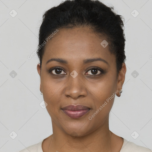 Joyful black young-adult female with short  black hair and brown eyes