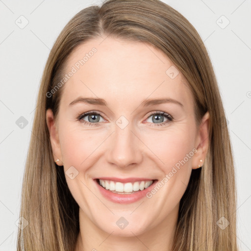 Joyful white young-adult female with long  brown hair and grey eyes