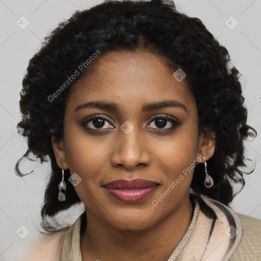 Joyful black young-adult female with long  black hair and brown eyes