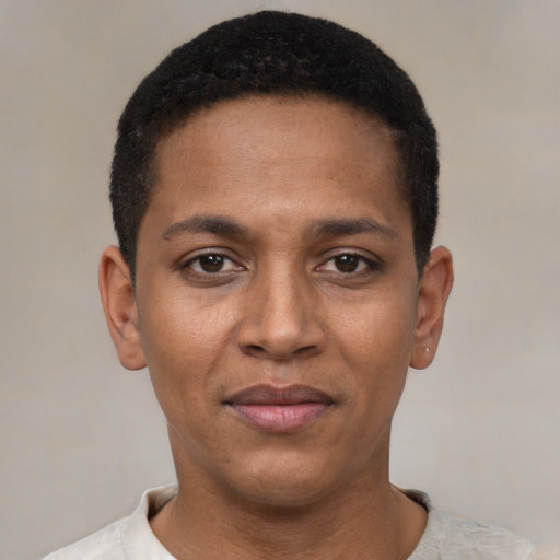 Joyful black young-adult male with short  black hair and brown eyes