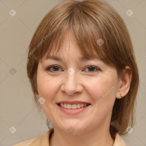 Joyful white adult female with medium  brown hair and brown eyes