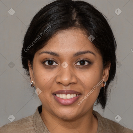 Joyful black young-adult female with medium  brown hair and brown eyes