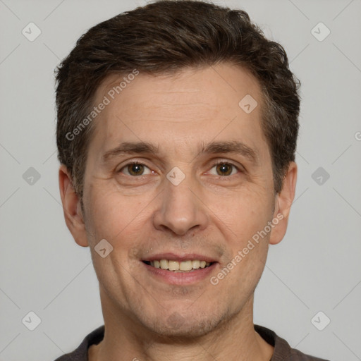 Joyful white adult male with short  brown hair and brown eyes