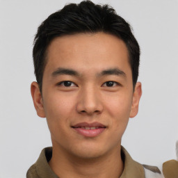 Joyful latino young-adult male with short  brown hair and brown eyes