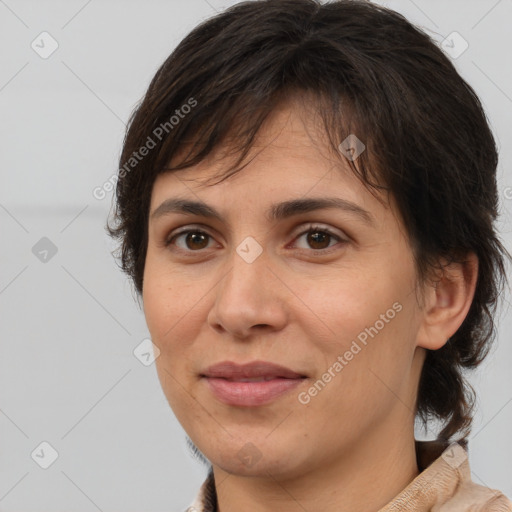 Joyful white adult female with medium  brown hair and brown eyes