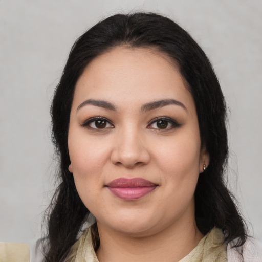 Joyful latino young-adult female with medium  black hair and brown eyes