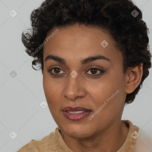 Joyful black young-adult female with short  brown hair and brown eyes