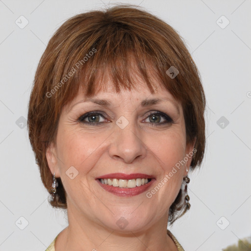 Joyful white adult female with medium  brown hair and grey eyes