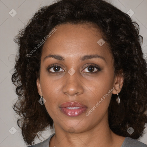 Joyful black young-adult female with medium  brown hair and brown eyes