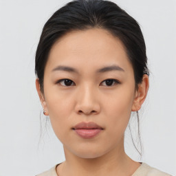 Joyful asian young-adult female with medium  brown hair and brown eyes