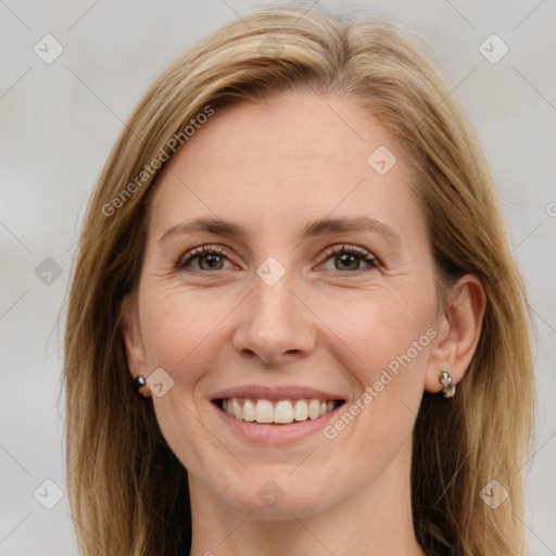 Joyful white young-adult female with long  brown hair and blue eyes