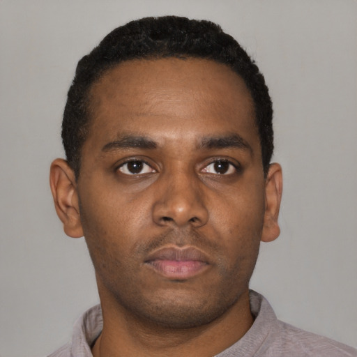 Neutral latino young-adult male with short  brown hair and brown eyes