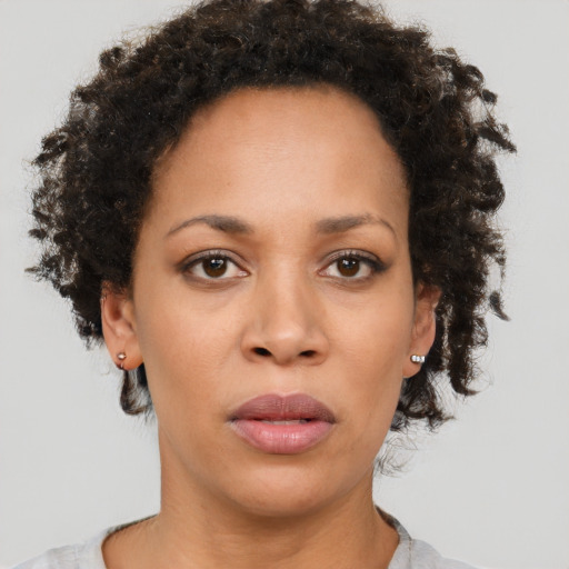 Neutral black young-adult female with short  brown hair and brown eyes