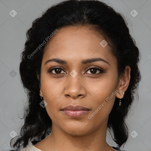 Joyful black young-adult female with medium  black hair and brown eyes