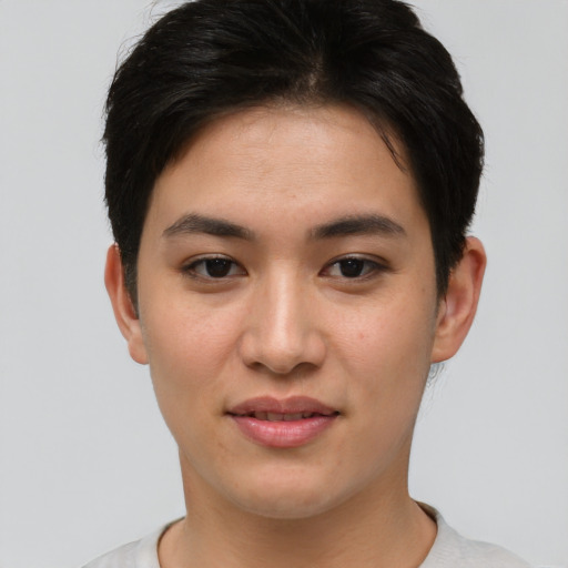 Joyful asian young-adult female with short  brown hair and brown eyes