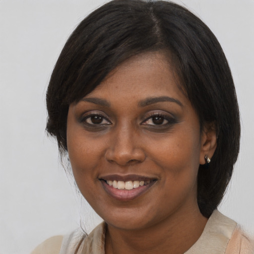 Joyful asian young-adult female with medium  black hair and brown eyes